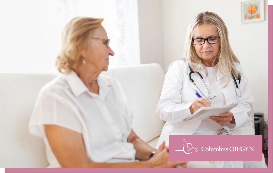 An elderly woman consulting a doctor about menopausal symptoms in a medical office.
