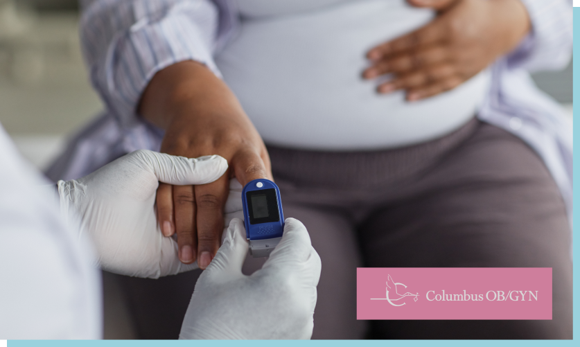 Pregnant Woman Undergoing Oxygen Saturation Monitoring during Checkup